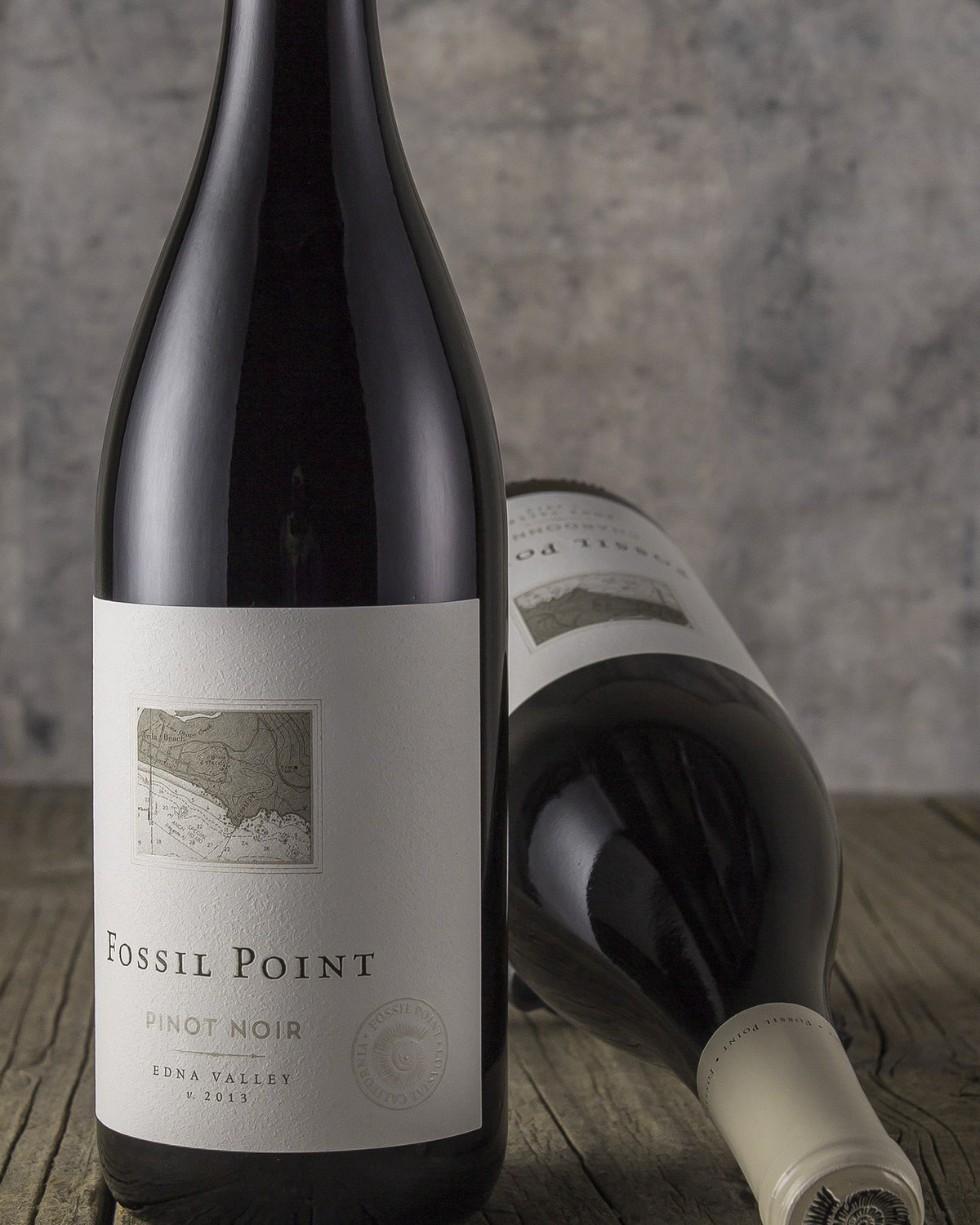 Fossil Point Pinot Noir on weathered wood
