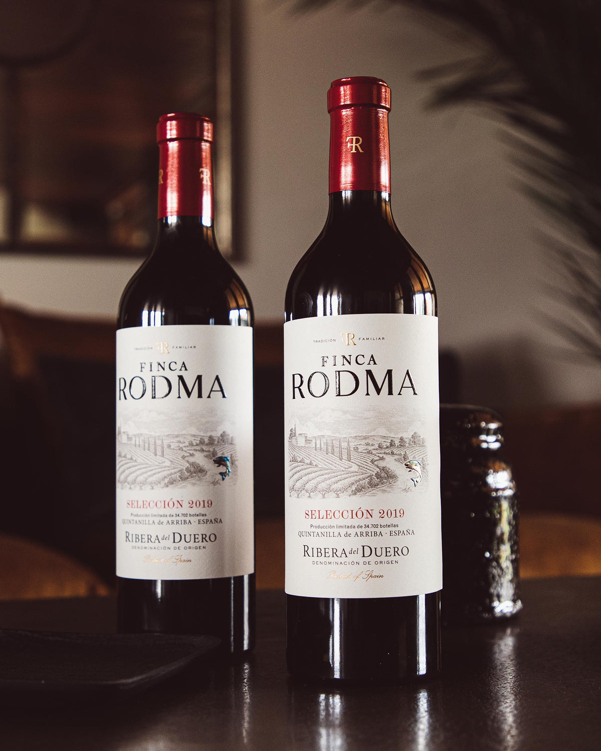 Finca Rodma Selección on a lounge table with a branded glass